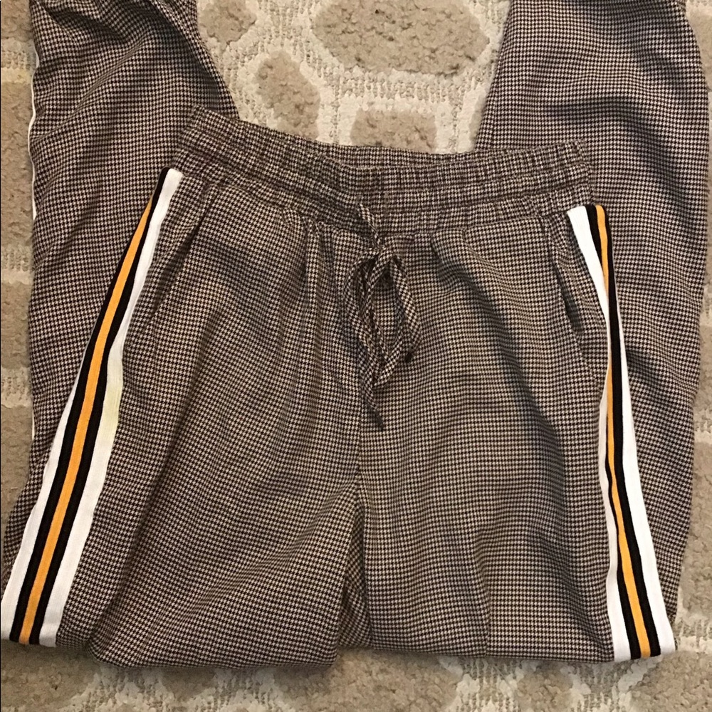 Checkered jogger pants with stripes.